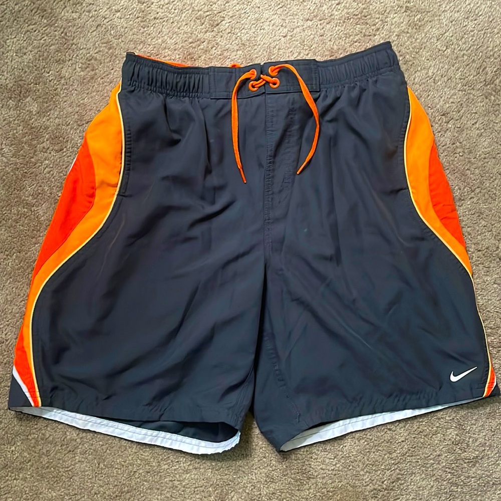 Gray and orange Nike swim shorts